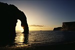 Durdle Door natural arch at sunset, Dorset, England